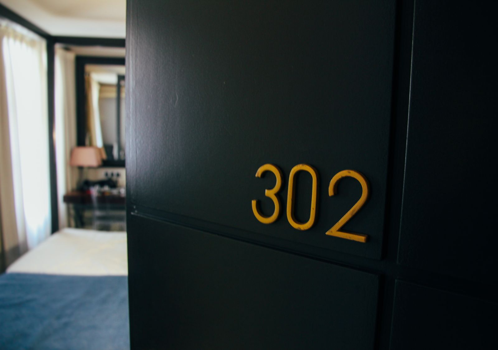 Numbered apartment door with keys in the lock
