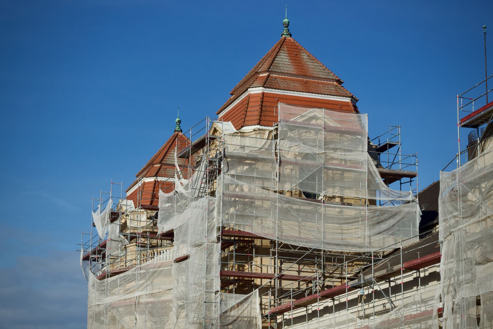 Building facade covered in renovation scaffolding